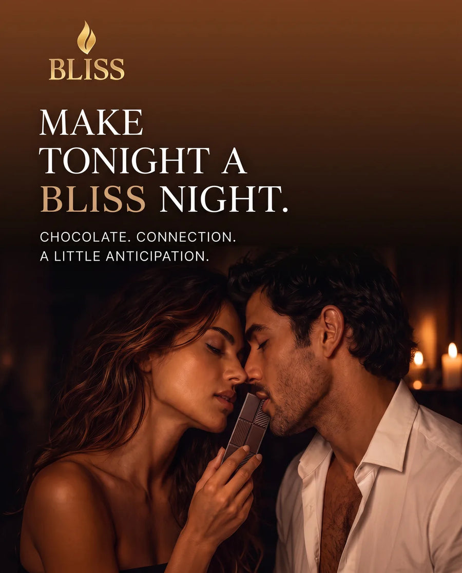 Make tonight a BLISS night — couple sharing BLISS chocolate by candlelight